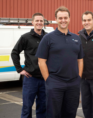 three of our Rocklin plumbers standing by their plumbing truck